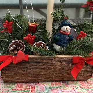 Log Centerpiece with decorations and candle