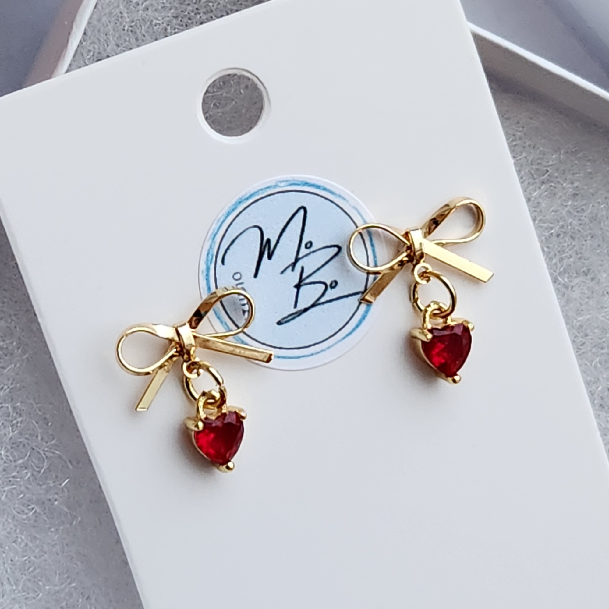 18K Gold Plated Bow Stud Earrings with Ruby Cubic Zirconia and 18K Gold Plated Charms