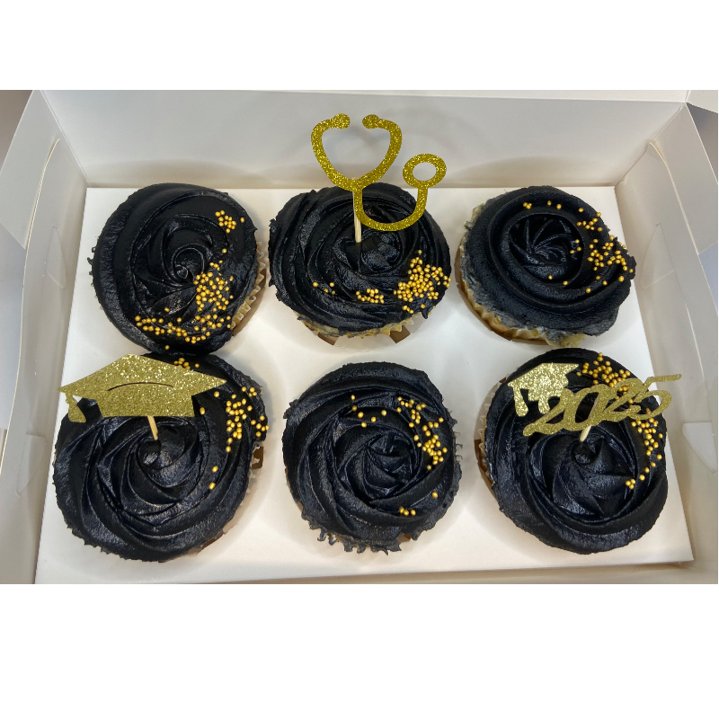 All Black cupcakes with gold toppers