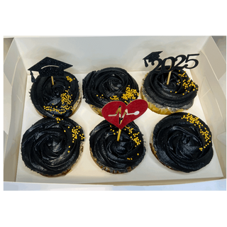 All white cupcakes with gold toppers and gold sprinkles