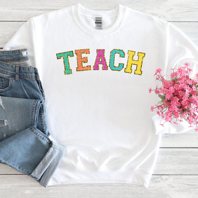 TEACH (chenille letters on white)