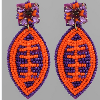 C86- beaded football earrings- orange & purple 