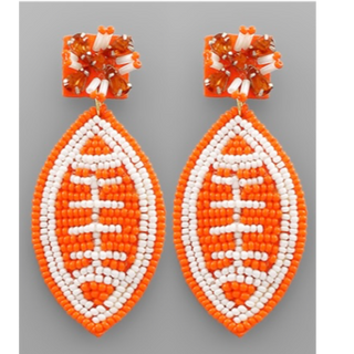 T18- white & orange beaded football earrings