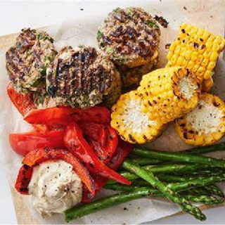 Beef feta and mint patties with grilled veggies and street corn salad