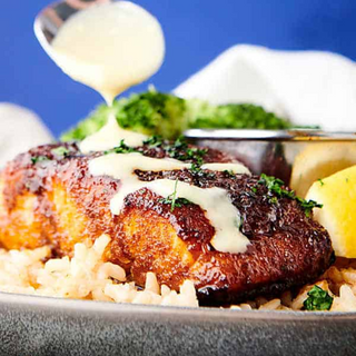 cajun salmon bites over dirty rice