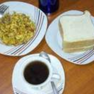 B2- Black tea + 2 eggs & 2slices of Bread (boiled, Fried or Omelette Style) Image