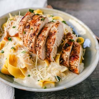 Grilled Chicken Over Fettuccine Alfredo