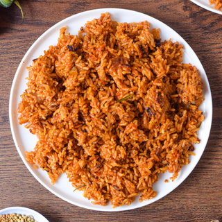 Gizzdodo on a bed of Jollof Rice & Fried Rice with Moin-Moin, Crunchy Salad & 2 proteins